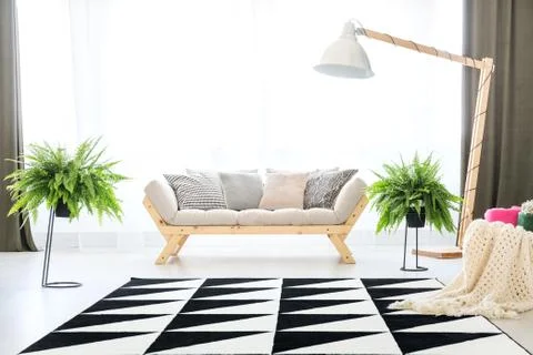 Grey sofa in flat interior Stock Photos