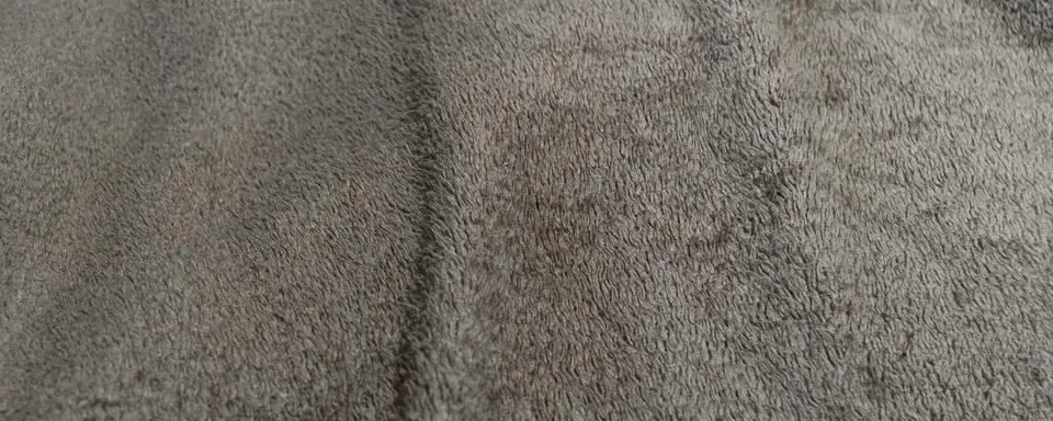 Grey Soft Fluffy Blanket Texture Close Up with Folds Stock Photos