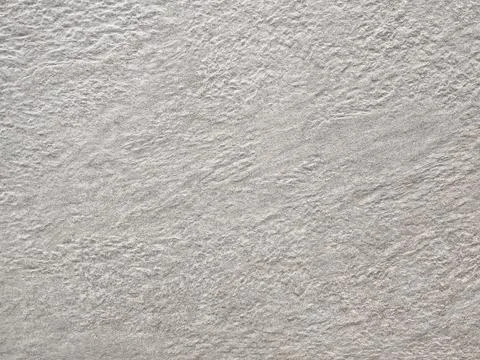 Grey speckled stone texture or composite material background 库存照片