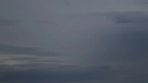 Grey spindrift clouds in sky time lapse getting dark from evening to night Stock Footage 153427401