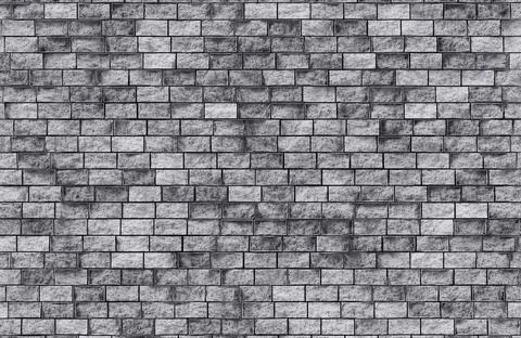 Grey stone block wall texture background for architectural and construction Illustrazione stock