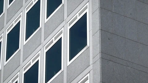 Grey stone façade of a skyscraper Stockbeeldmateriaal 111631720
