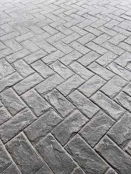 Grey Stone Pavement with Herringbone Pattern Stock Photos