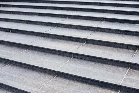 Grey stone steps in modern style, large staircase with stone-like grey textur Stock Photos