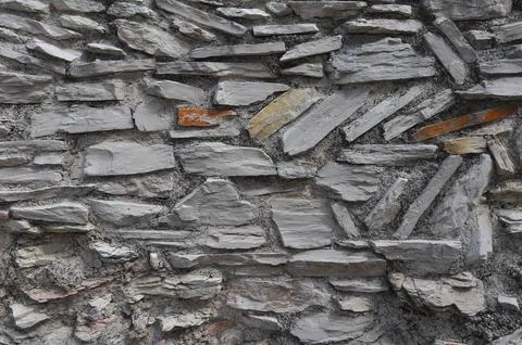 Grey stone wall background Stock Photos