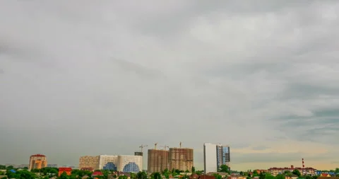 Grey storm clouds over the town Stock Footage 138444998