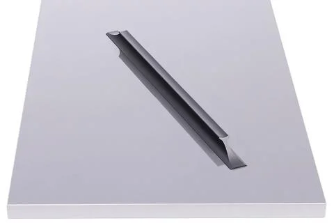 Grey table with a long handle on top designed for utility in a clean setting 写真素材