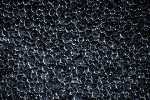 Grey texture background. Black styrofoam foam material or white plastic polys Stock Photos