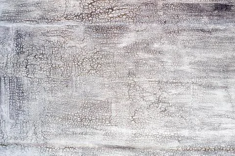 Grey texture with crackles. Stock Photos