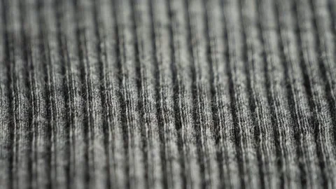 Grey texture of ribbed knitted fabric. Knitted fabric close up. Stock Footage 308530649