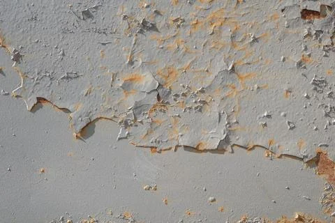 Grey texture, surface of rusty iron with remnants of old paint, chipped paint Stock Photos