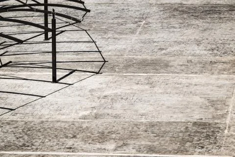 Grey tiled floor with shadows from a canopy Stock Photos