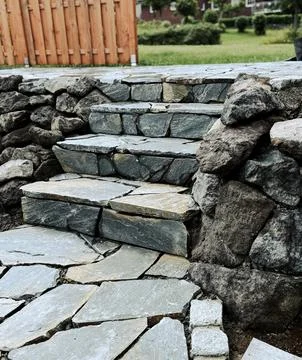 Grey tiled steps in rectangular pattern, showing texture, structure, and sh.. Stock Photos