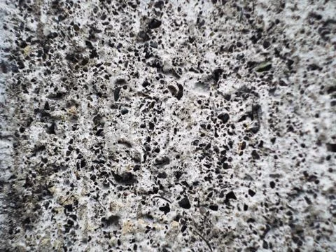 Grey wall made of marble aggregate with small crumbs, close up view. 스톡 사진