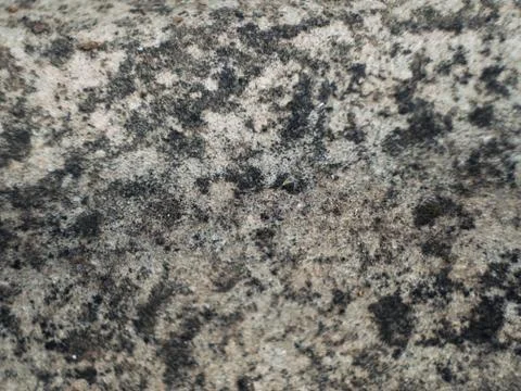 Grey wall made of marble aggregate with small crumbs, close up view. Stock Photos