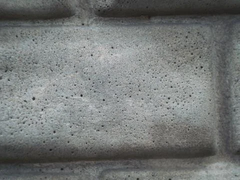 Grey wall made of marble aggregate with small crumbs, close up view. Stock Photos
