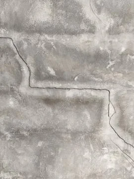 Grey weathered concrete texture with deep horizontal fissure and cracked pl.. Stock Photos