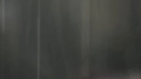 Grey window glass with rain drops. Gloomy Blurred view Stock Footage 314277180