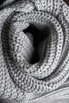 Grey wool scarf on a dark background.selective focus. Stock Photos