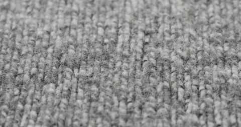 Grey woolen fabric close-up. Macro shooting of soft and warm knitted cloth Video stock 167895280