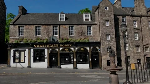 Greyfriars Bobby Monument with pub in background Edinburgh Scotland UK Stock Footage 131734562