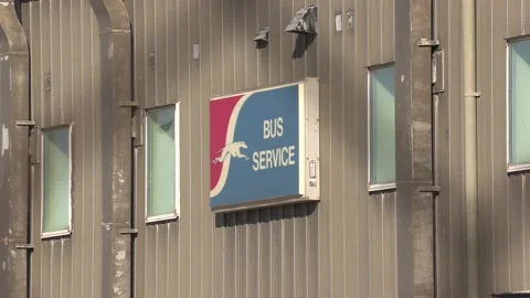 Greyhound Canada coach buses sit parked after going out of business in recession Stock Footage 154080462