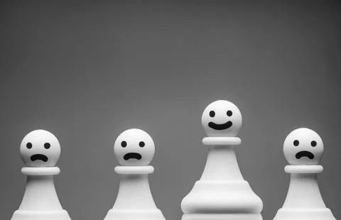 Greyscale image of happy and grumpy chess pieces Stock Photos