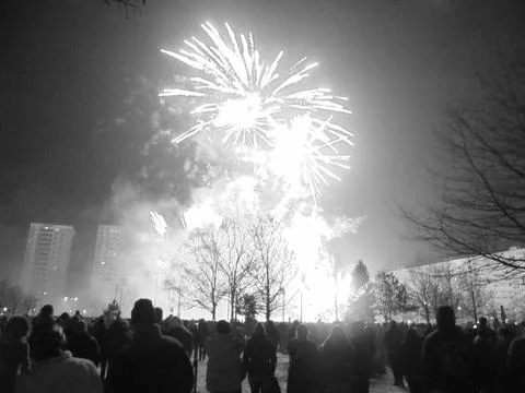 Greyscaled image - Red blazing explosion of New Year pyrotechnics. Foto stock