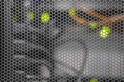 Grid background in the server room with wires from computers and network equi 스톡 사진