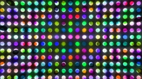 A grid of bright, glowing circular lights illuminates a dark background. Stock Illustration