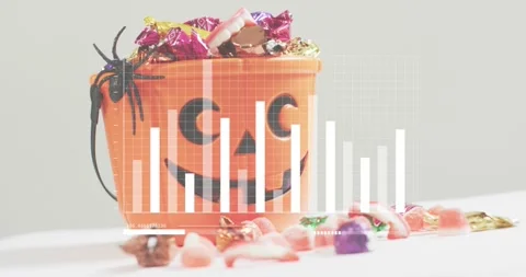 Grid fading in over pumpkin bucket, bars rising and falling to visualize candy Stock Footage 317791725
