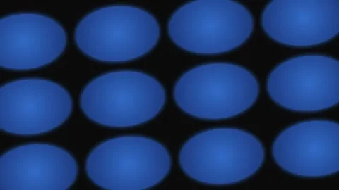 A grid of glowing blue oval shapes arranged against a dark black background Stock Footage 339618213
