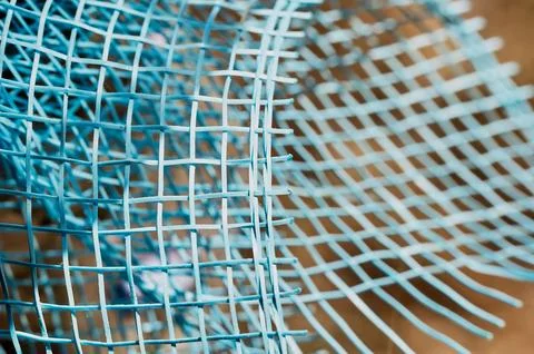 Grid of grids in selective focus on a brown background Stock Photos