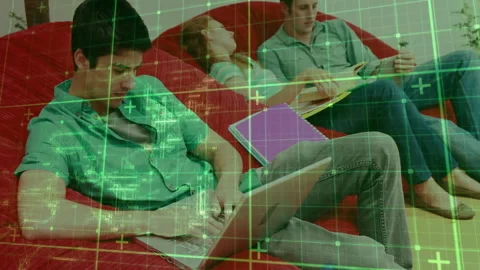 Grid overlay fading revealing study scene with man typing code laptop and Stock Footage 312361402