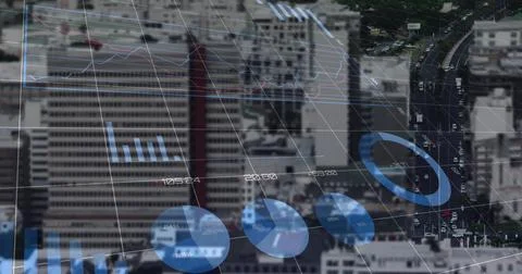 Grid overlay floating over high-rise skyline and roadway, showing line graph, Stock Photos