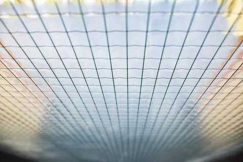 Grid pattern creating a texture with converging lines, providing an abstract Stock Photos