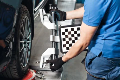 Grid sensor sets mechanic on auto. Car  stand with sensors wheels for alignment Stock Photos