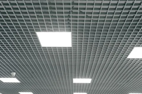 Grid structure of suspended ceiling. Contemporary interior design. Stock Photos