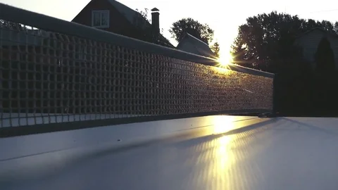 Grid on a tennis table close-up in the rays of sunset. slowmotion, 1920x1080, hd Stock Footage 81179601