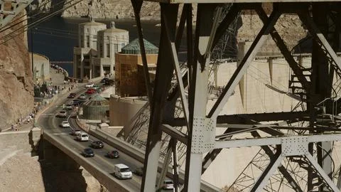 Grid tower frame the distant  intake towers Hoover Dam. Stock Photos
