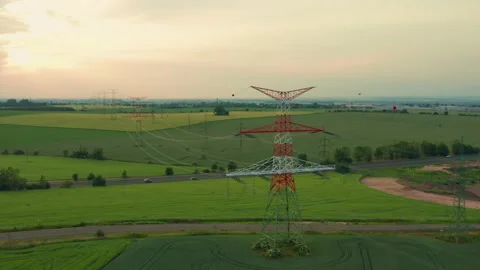 Grid tower with power transmission lines at rural site Stock Footage 170500109