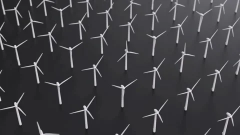 Grid of white wind turbines spinning on dark background Video stock 333828854