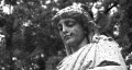 Grieving cemetery statue. Black and white. HD Footage