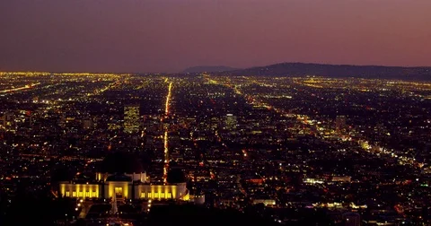 The Griffith Observatory and LA skyline in the distance at night in Los Angeles, 動画素材 81553044