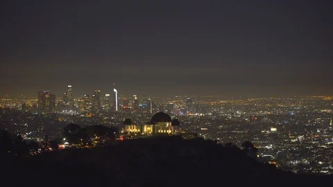 Griffith Observatory building and Los Angeles lights at night Stock Footage 86111017