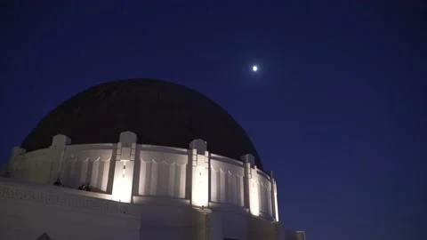 The Griffith Observatory at Night with Clear Sky and the Moon.  Video stock 141559989