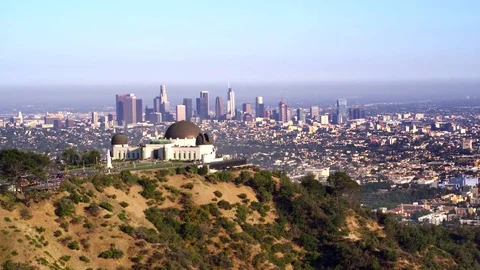 Griffith Park Observatory and view of Downtown Los Angeles by Aerial Drone Видео 78010464
