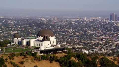 Griffith Park Observatory and view of Downtown Los Angeles by Aerial Drone Stock Footage 78010521