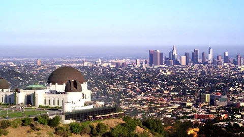 Griffith Park Observatory and view of Downtown Los Angeles by Aerial Drone Stock Footage 78010575