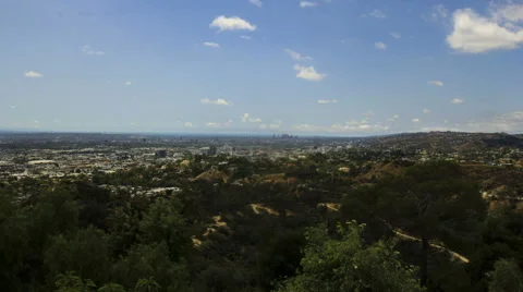 Griffith Park trails and Los Angeles with Pacific Ocean in the horizon Stock Footage 64273335